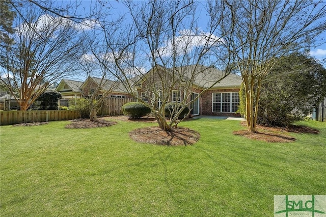 view of yard with fence