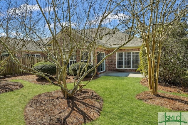 view of yard with a patio and fence