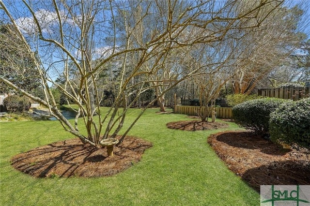 view of yard featuring fence