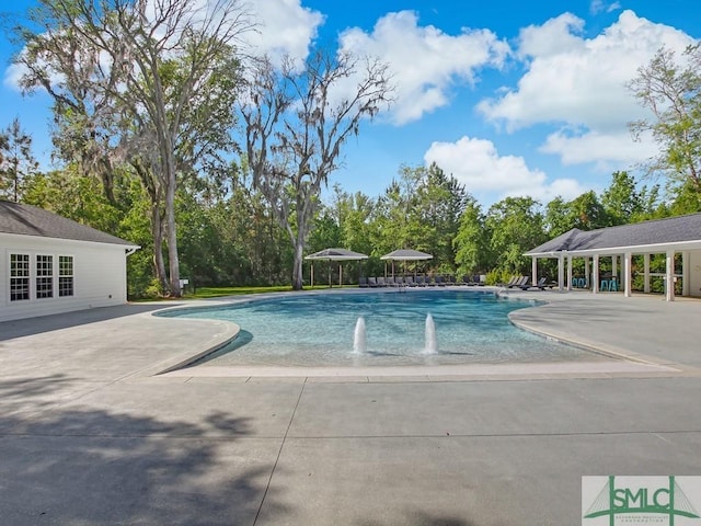 outdoor pool with a patio