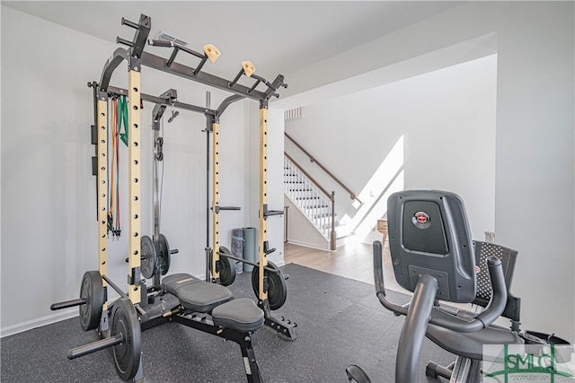 workout room with visible vents and baseboards