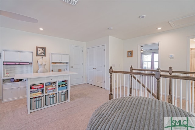 interior space featuring recessed lighting, light colored carpet, and visible vents