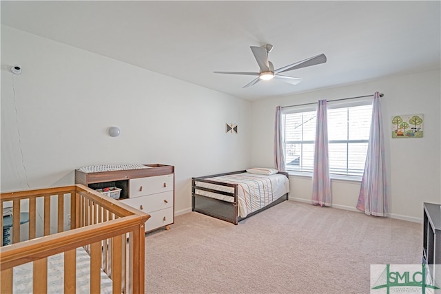 bedroom featuring ceiling fan, carpet flooring, and baseboards