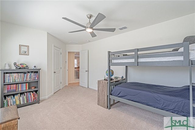 bedroom featuring baseboards, visible vents, ceiling fan, and carpet flooring