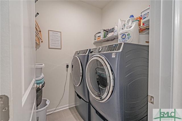 laundry area with laundry area, tile patterned flooring, and separate washer and dryer