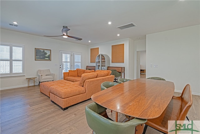 living area featuring light wood-style floors, recessed lighting, and visible vents