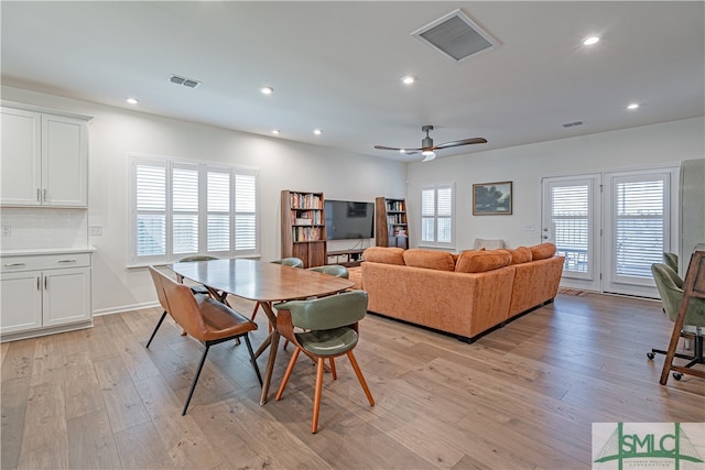 dining room featuring light wood-style flooring, visible vents, a ceiling fan, and recessed lighting