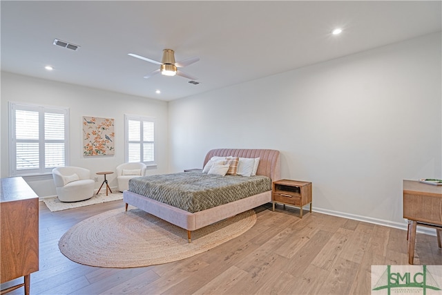 bedroom featuring recessed lighting, visible vents, baseboards, and wood finished floors