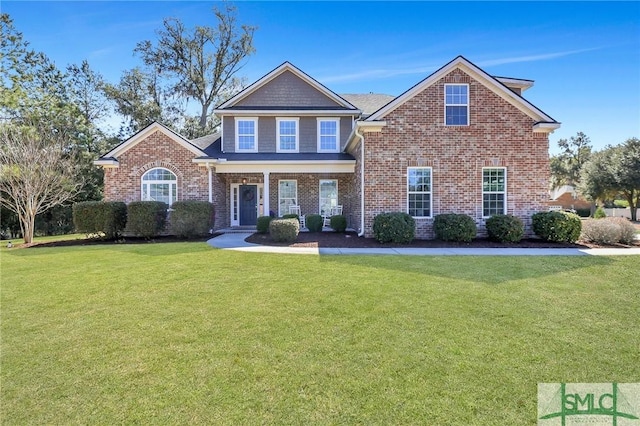 craftsman-style house featuring brick siding and a front lawn