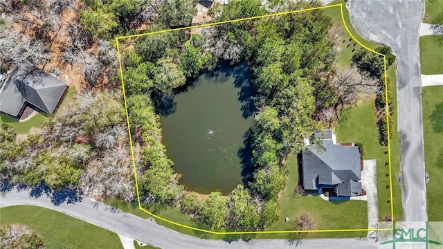 birds eye view of property featuring a water view