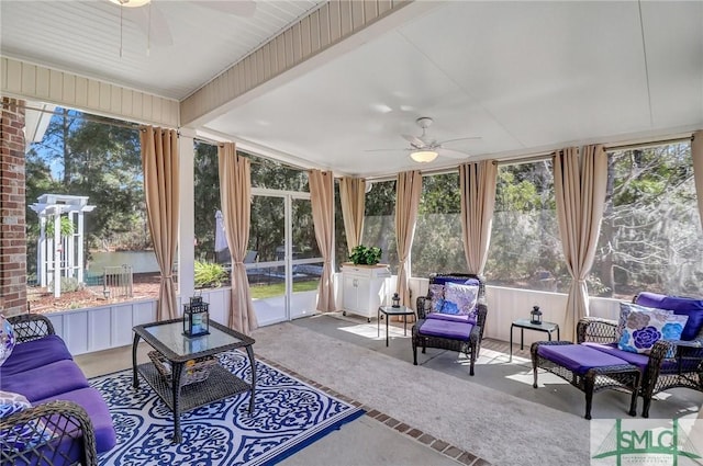 sunroom featuring ceiling fan and a wealth of natural light