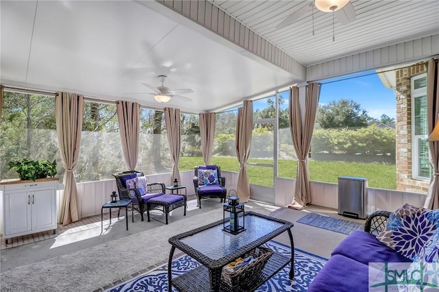 sunroom featuring a ceiling fan