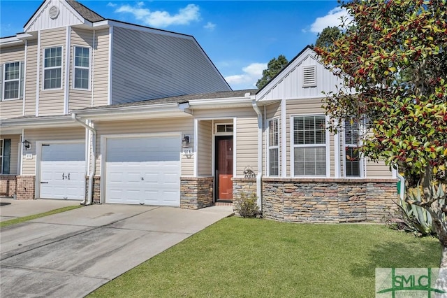 view of front of home with driveway, a front lawn, and board and batten siding