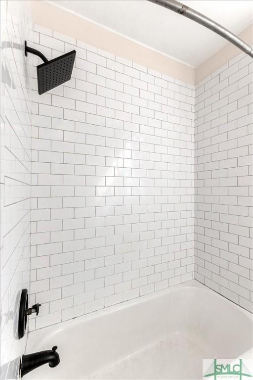 full bath with shower / tub combination