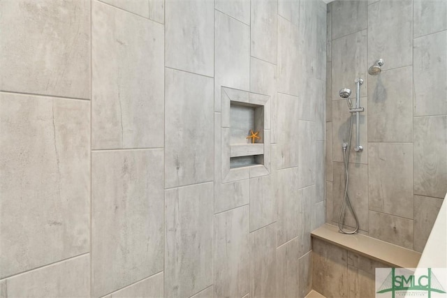 full bathroom featuring a tile shower