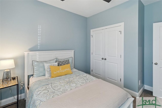 bedroom with a closet and baseboards