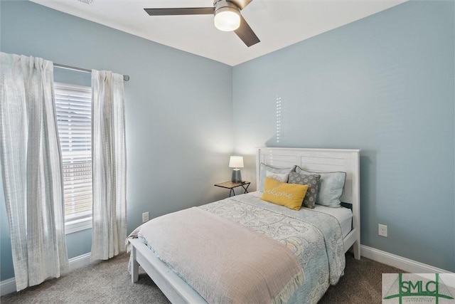 carpeted bedroom featuring a ceiling fan and baseboards