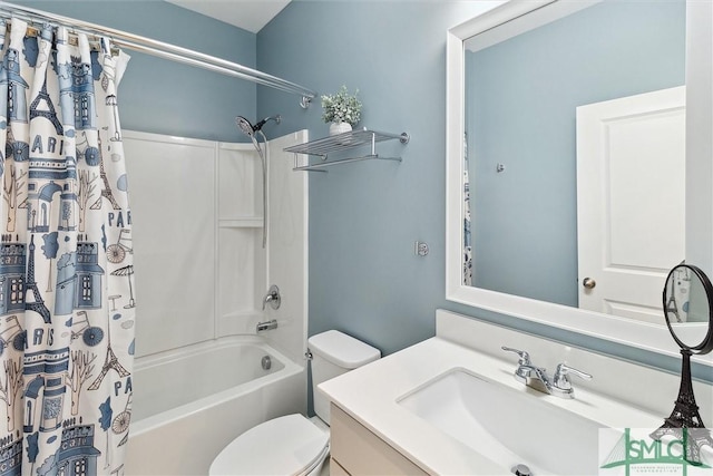 bathroom with shower / tub combo with curtain, vanity, and toilet