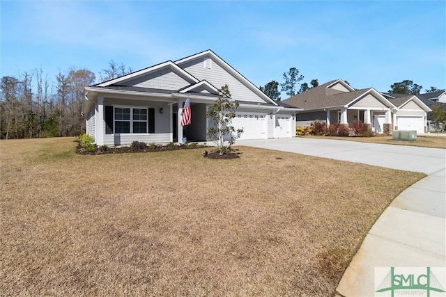 view of front facade featuring a garage, driveway, and a front lawn