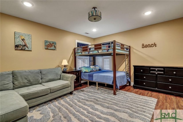 bedroom featuring visible vents, wood finished floors, and recessed lighting