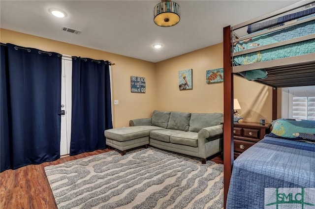 bedroom featuring visible vents, wood finished floors, and recessed lighting