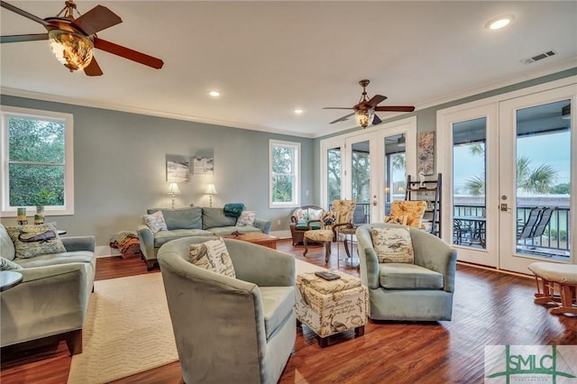 living room featuring recessed lighting, visible vents, french doors, ornamental molding, and dark wood-style floors