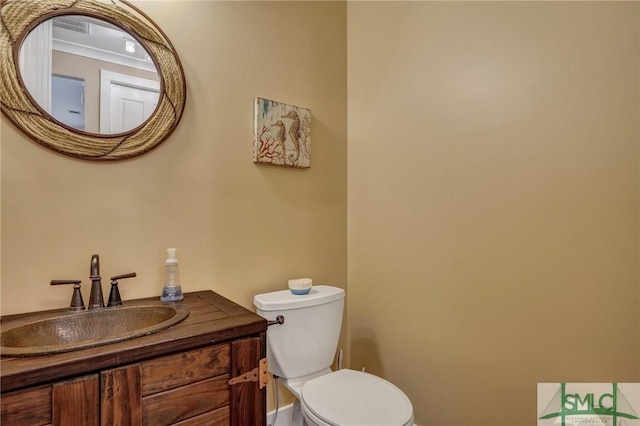 half bath with vanity and toilet