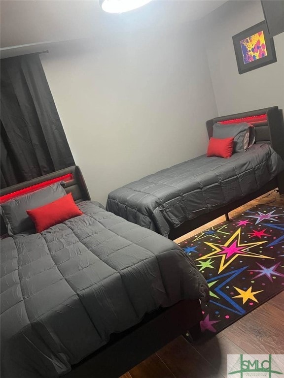 bedroom featuring wood finished floors