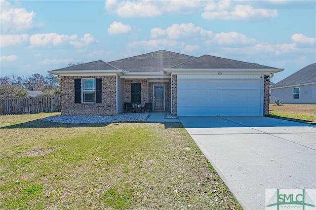 single story home featuring brick siding, an attached garage, fence, driveway, and a front lawn