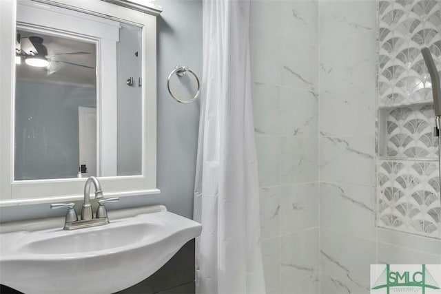 bathroom with a shower with curtain and a sink