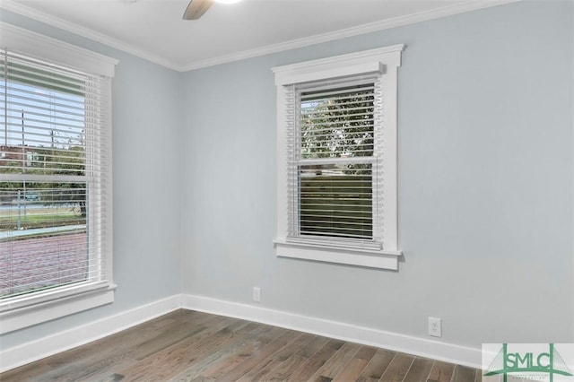 unfurnished room featuring dark wood-style floors, ceiling fan, baseboards, and crown molding