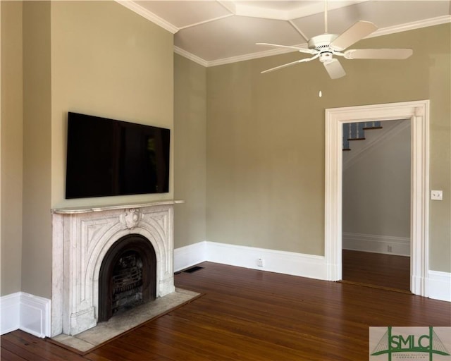 unfurnished living room with a fireplace, wood-type flooring, and ornamental molding