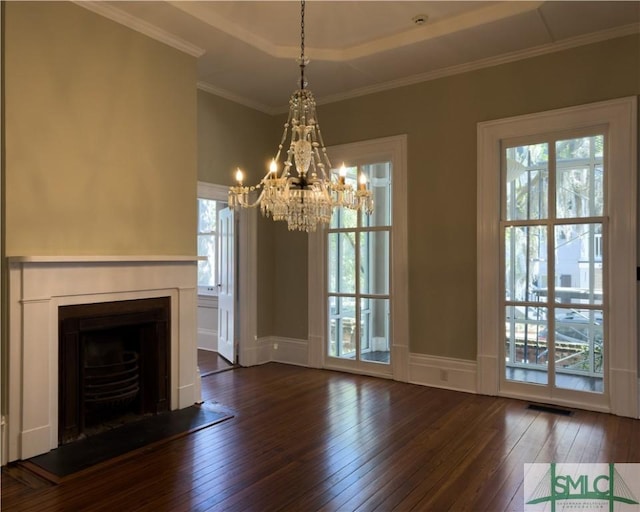 unfurnished living room with visible vents, crown molding, a fireplace, and dark wood-style flooring