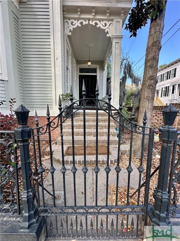 view of gate with fence