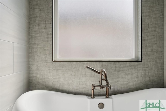 bathroom featuring a soaking tub