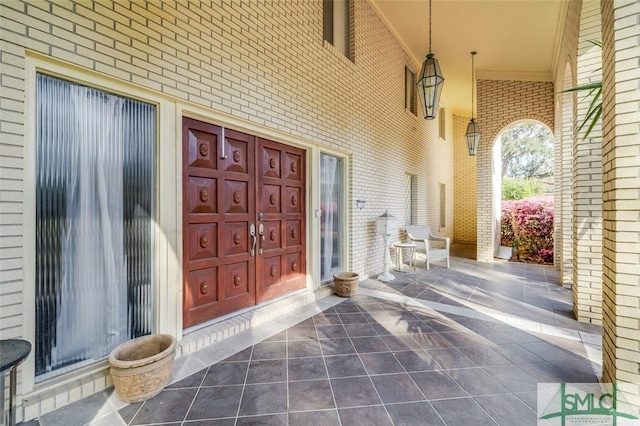 view of exterior entry featuring a porch