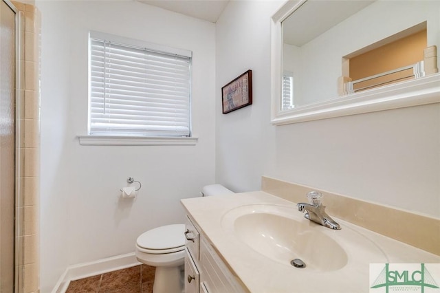 full bath with a shower, toilet, vanity, baseboards, and tile patterned floors