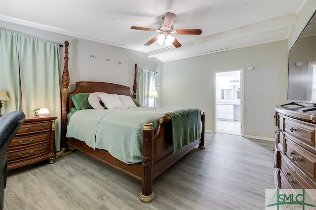 bedroom with light wood-style floors, beamed ceiling, baseboards, and ceiling fan