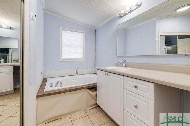 bathroom with ornamental molding, tile patterned floors, vaulted ceiling, a textured ceiling, and vanity