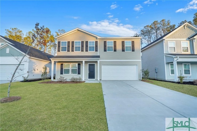 view of front of house featuring a garage, driveway, and a front lawn