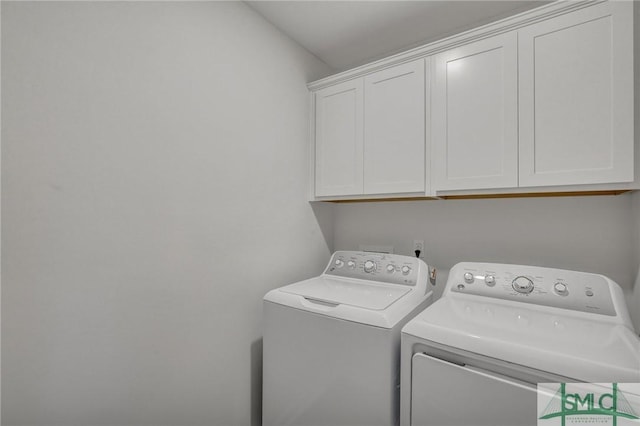 laundry area with washer and dryer and cabinet space