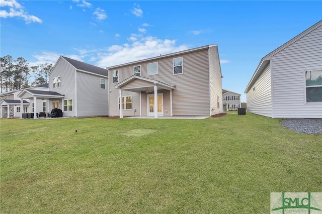 back of property featuring a yard, a patio, and cooling unit