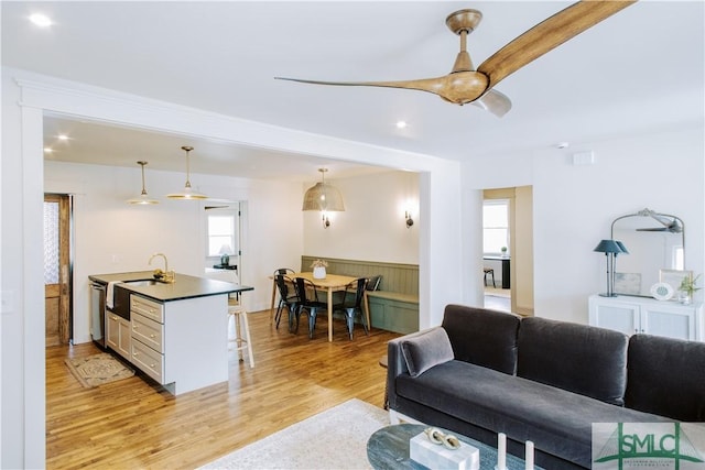 living area with wainscoting and light wood-style flooring