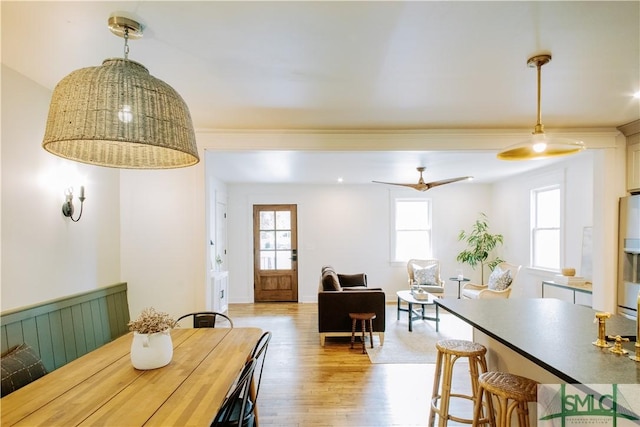 dining area featuring light wood-style flooring