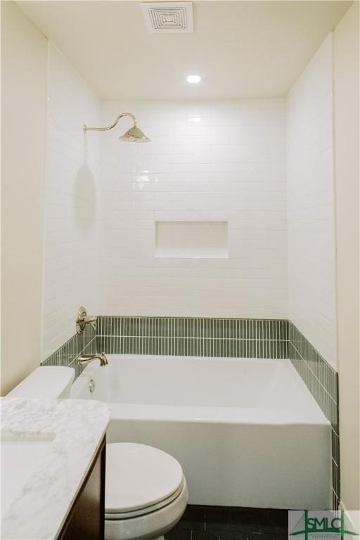 bathroom with toilet, visible vents,  shower combination, and vanity