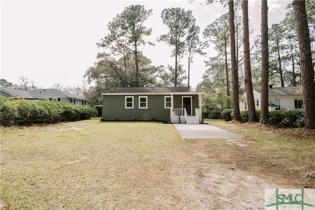 back of house with a lawn