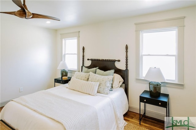 bedroom with ceiling fan, wood finished floors, and recessed lighting