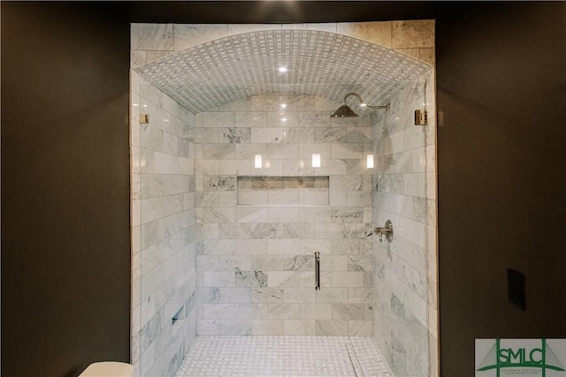 bathroom with a shower stall