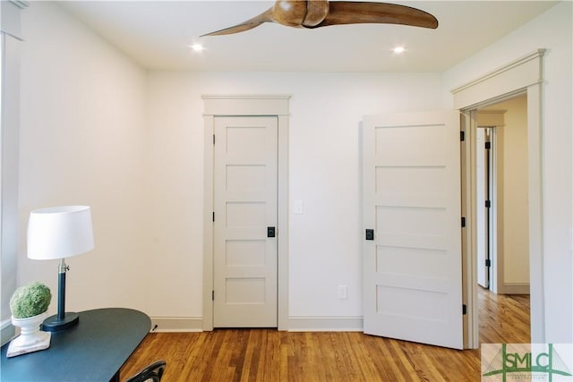 office area with baseboards, a ceiling fan, wood finished floors, and recessed lighting