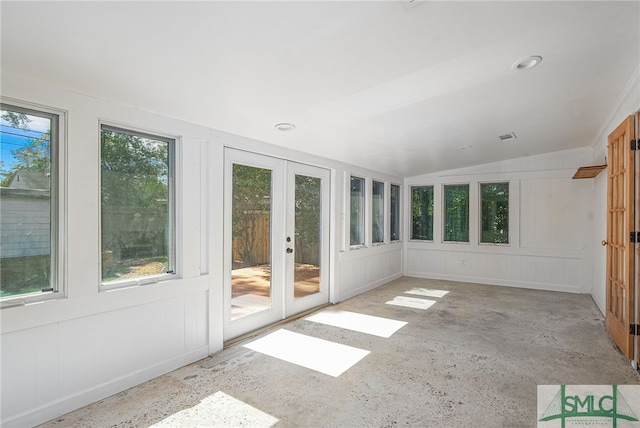 unfurnished sunroom with french doors, visible vents, and vaulted ceiling